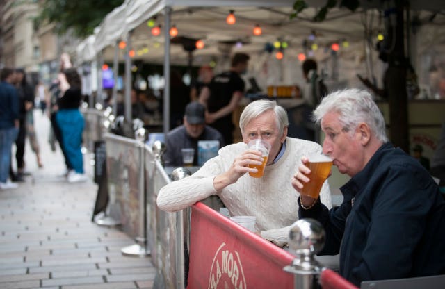 Members of the public enjoy a drink