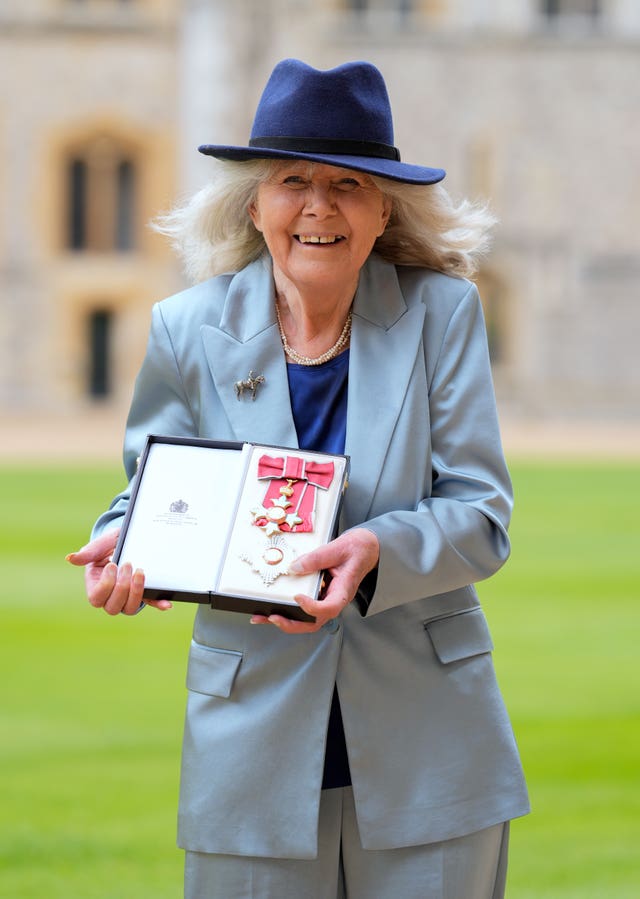 Dame Jilly Cooper after being made a Dame Commander of the British Empire by the King at Windsor Castle, Berkshire