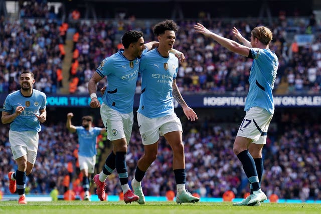 Manchester City players celebrate a goal