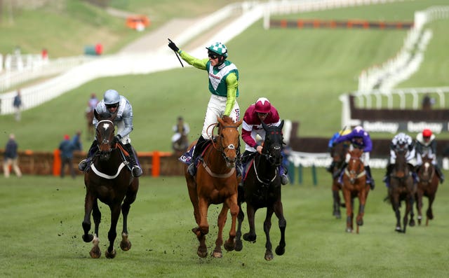Harry Cobden salutes the crowd after steering Topofthegame to victory in the RSA Insurance Novices’ Chase at Cheltenham
