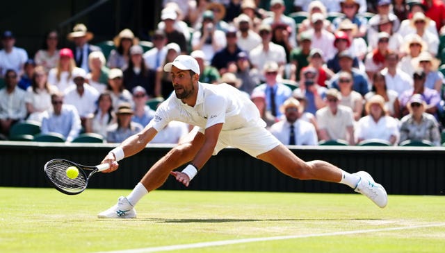 Novak Djokovic slides