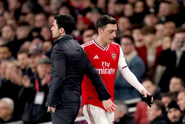 Mesut Ozil, right, has not played since March 