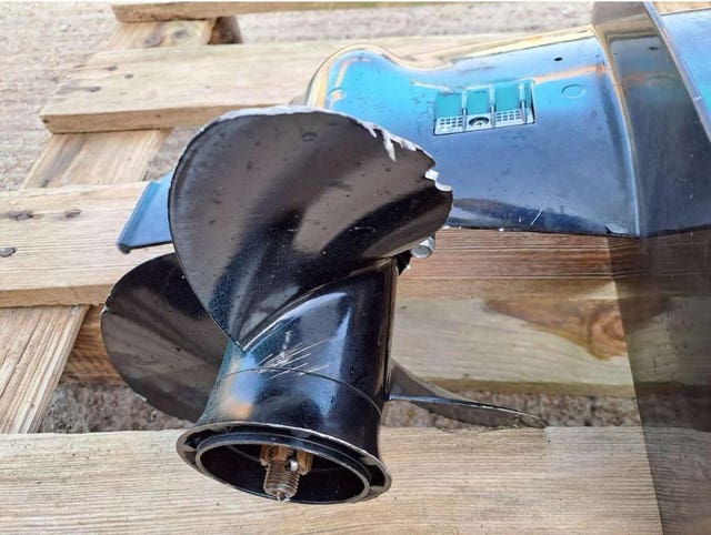 A worn propeller on an outboard motor used on a boat piloted by Chan Atak