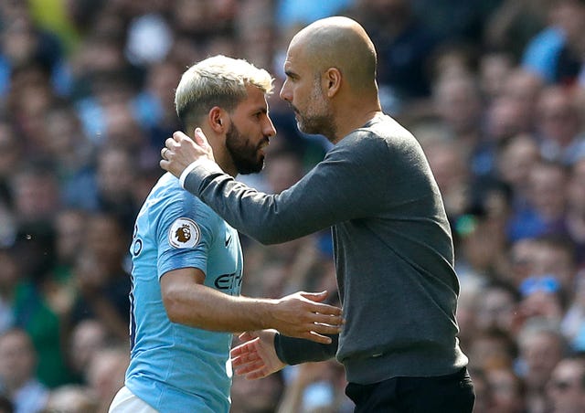 Sergio Aguero is embraced by manager Pep Guardiola