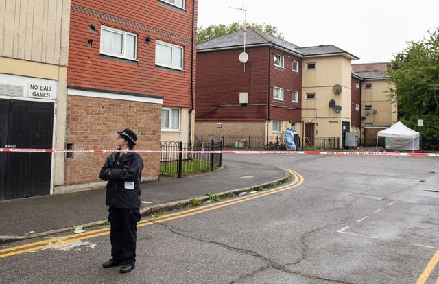 Police at the scene in Byford Close, Stratford, east London, where a 15-year-old boy was fatally stabbed (Dominic Lipinski/PA)