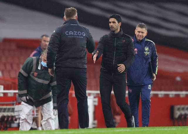 Mikel Arteta, right, shakes hands with Villa manager Dean Smith after the game