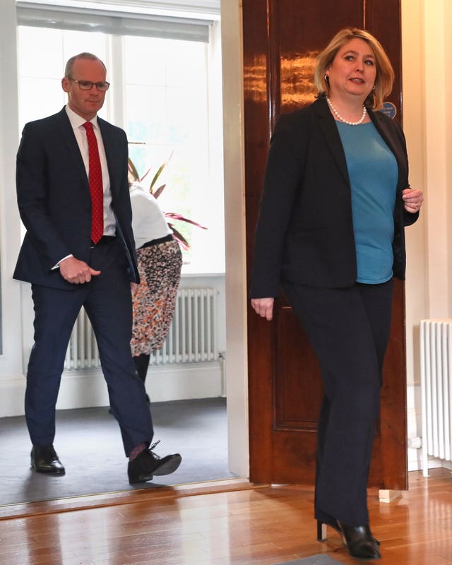 Simon Coveney and Karen Bradley arrive for a press conference at Stormont in Belfast