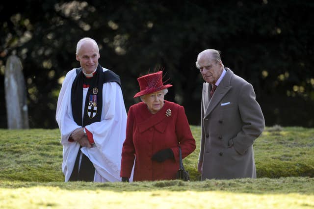 The Queen and Duke of Edinburgh with Canon Jonathan Riviere (Joe Giddens/PA)
