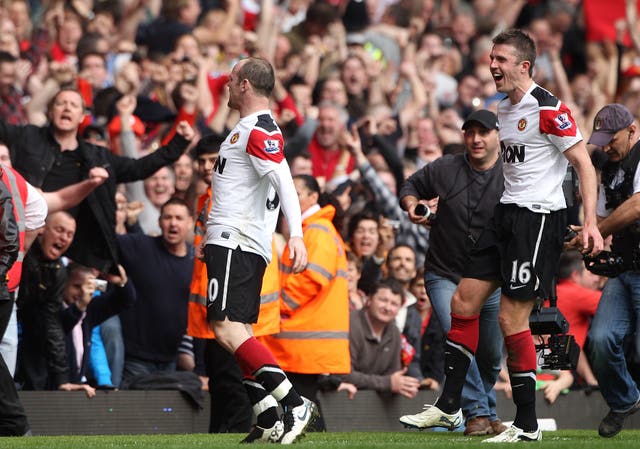 Wayne Rooney celebrates scoring his side's third goal of the game and his hat-trick