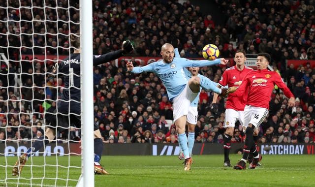 David Silva, centre, scores against Manchester United