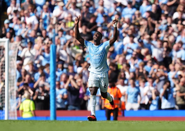 Manchester City's Marc Guehi celebrates after scoring an equaliser against Bournemouth