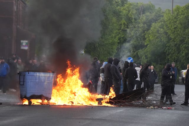 Bins set alight by protesters on Ligoniel Road, Belfast