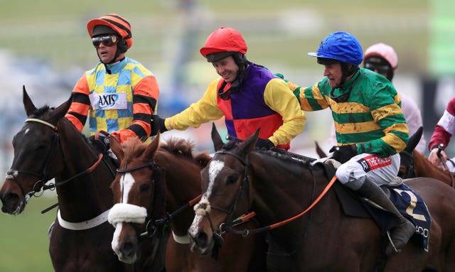 Richard Johnson is congratulated by Nico de Boinville (left) and Barry Geraghty after winning last year's Gold Cup