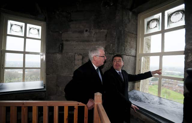 Minister for Finance Paschal Donohoe (right) and chairman of the Glasnevin Trust John Green look out one of the windows at the top of the tower (Brian Lawless/PA)