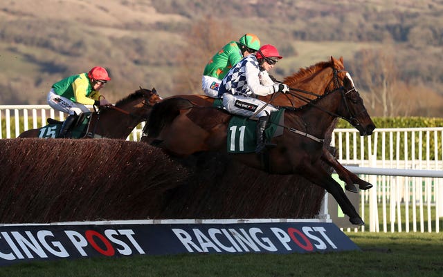 Rathvinden jumps alongside Ms Parfois before winning the National Hunt Chase
