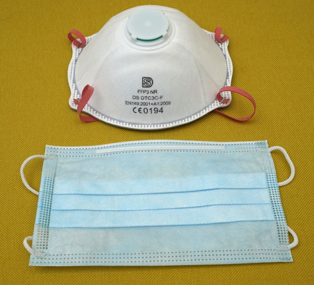 A filtering face piece 3 (FFP3) respirator (top) and a fluid resistant surgical mask