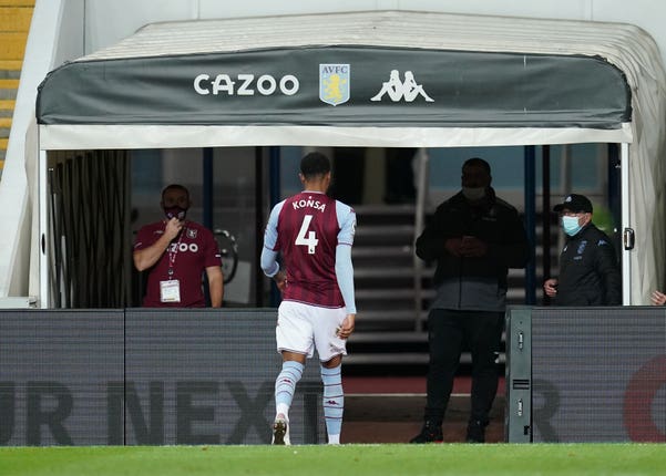 Ezri Konsa walks down the tunnel after his red card