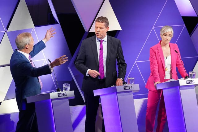 Nigel Farage gestures towards leader of Plaid Cymru Rhun ap Iorwerth and Liberal Democrat deputy leader Daisy Cooper