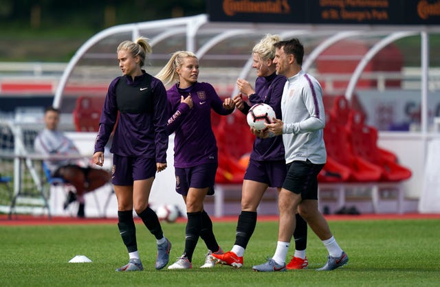 England Women manager Phil Neville (right) in training (PA)