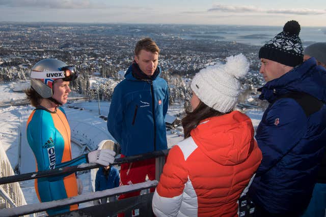 The Duke and Duchess of Cambridge meet junior ski jumpers from Norway's national team at the top of the Holmenkollen ski jump in Oslo, Norway, on the final day of their tour of Scandinavia Victoria Jones/PA)