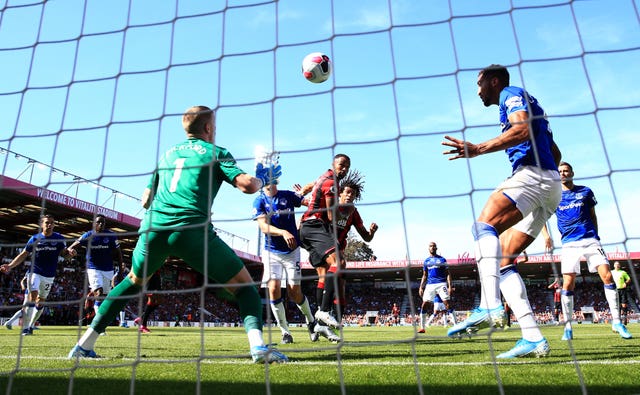 Callum Wilson (centre) nods in the opening goal of the game