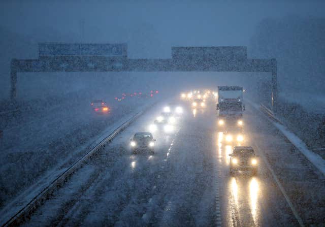 Traffic on the M9 near Falkirk during a snow blizzard in Central Scotland. (PA)