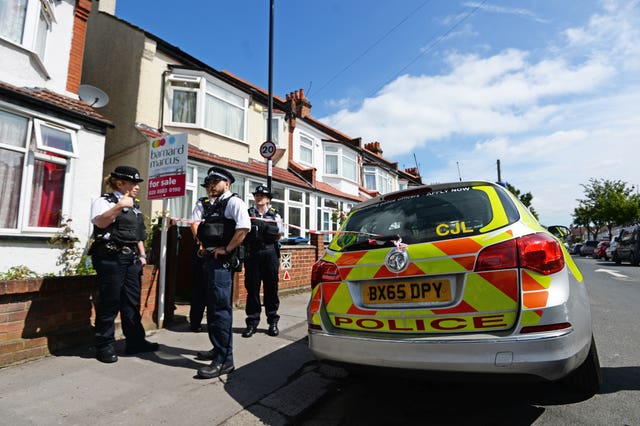 Police officers at the scene in Raymead Avenue, Thornton Heath