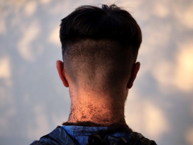 A photo issued by Historic England from its Picturing Lockdown Collection of Joshua Chhabra’s skin fade, a haircut given to him by his older brother Matthew, taken by commissioned artist Anand Chhabra in Wolverhampton
