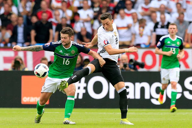 Norwood, left, played for Northern Ireland at Euro 2016