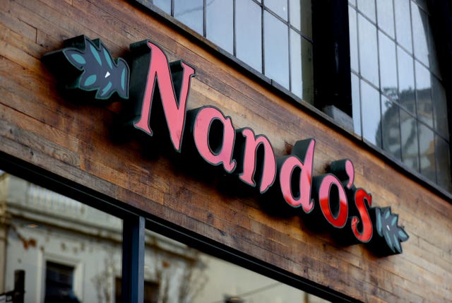 A Nando's sign at the entrance to an outlet