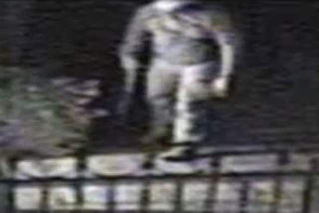 The armed burglar (Surrey Police/PA)