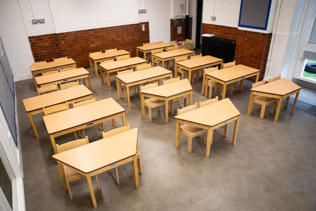 Tables and chairs spaced out for social distancing at the Charles Dickens Primary School in London
