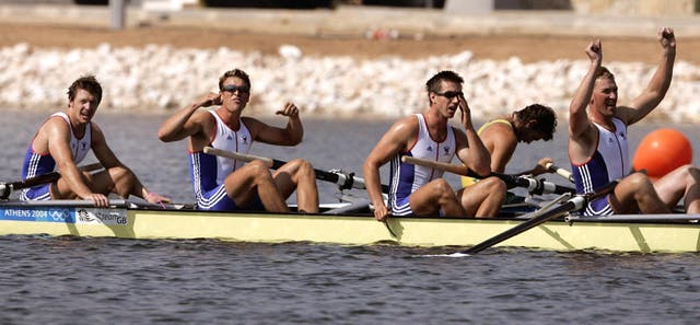 Cracknell, second left, and Pinsent, far right, celebrate winning gold at the 2004 Athens Olympic Games 
