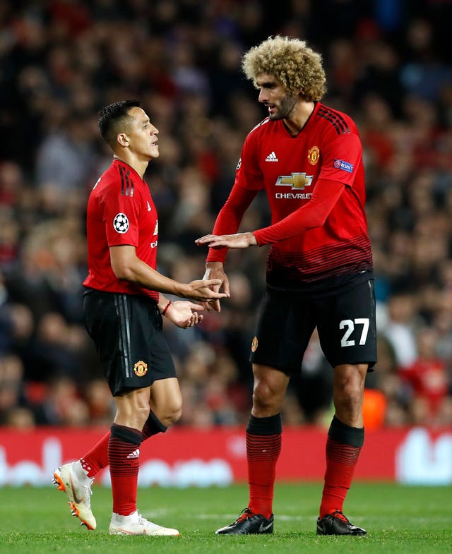Alexis Sanchez, left, was taken off against Valencia