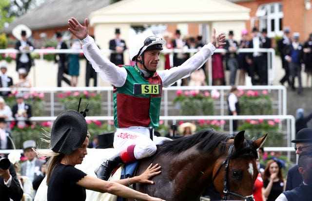 Frankie Dettori celebrates after the win of Without Parole