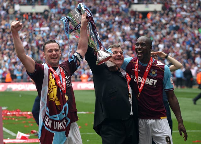 Allardyce, centre, celebrates with the trophy as his West Ham team gain promotion to the Premier League