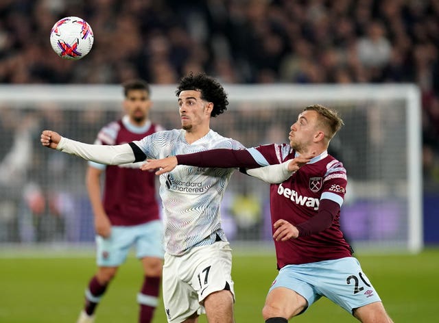 Jarrod Bowen battles for the ball with Curtis Jones