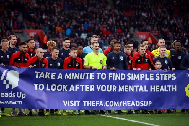 Southampton and Huddersfield players show their support for the Heads Up campaign
