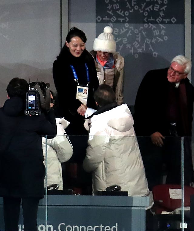 South Korean president Moon Jae-in shakes hands with Kim Yo-jong, the sister of North Korean leader Kim Jong-un