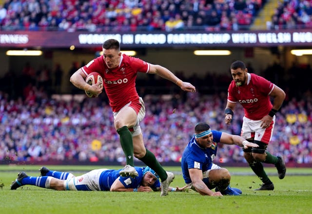 Josh Adams breaks away to score Wales' third try