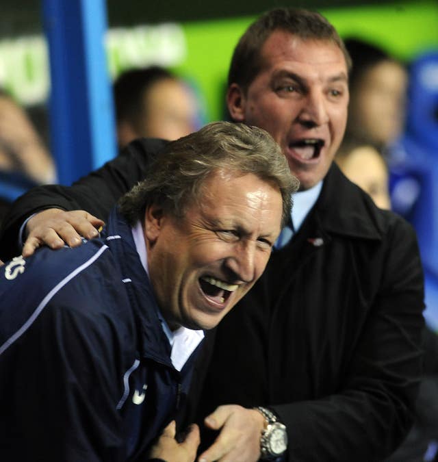 During his time in charge of Reading, the Northern Irishman enjoys a joke with then Crystal Palace boss Neil Warnock 