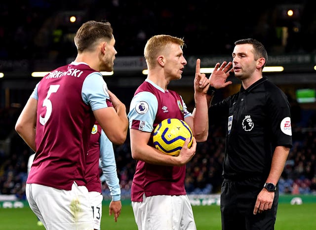 Match referee Michael Oliver waits for the VAR decision after Chelsea’s Callum Hudson-Odoi goes down in the penalty area in Burnley