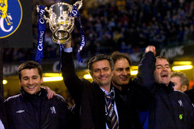 Mourinho holds up his first silverware as Chelsea boss following a Carling Cup final win over Liverpool