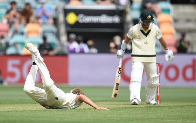 Stuart Broad hits the deck early on