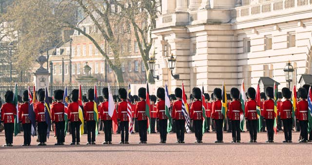A Guard of Honour turns out on the forecourt of Buckingham Palace (Gareth Fuller/PA)