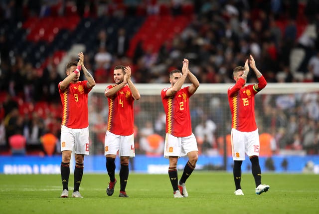 Spain's players applaud the fans after their victory over England 