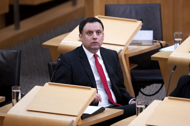 Anas Sarwar seated in Holyrood