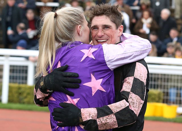 Honours equal? This year's County Hurdle hero Harry Skelton celebrates with partner and last year's winner Bridget Andrews