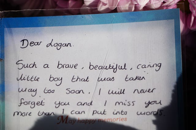 Tributes left at the scene in the Sarn area of Bridgend, South Wales, near to where five-year-old Logan Mwangi was found dead