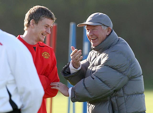 Ole Gunnar Solskjaer, right, says it has been a while since he last spoke to Sir Alex Ferguson (Martin Rickett/PA)
